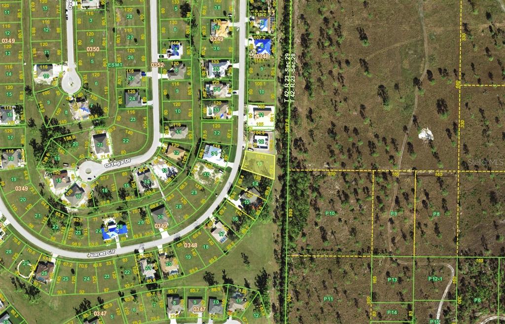 This is an aerial map showing residential lots and streets in a suburban neighborhood — 16129 JUAREZ CIRCLE, PUNTA GORDA, FL