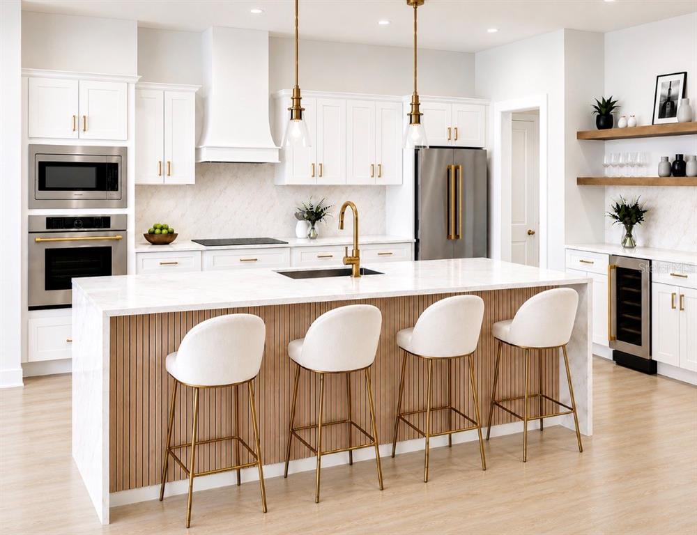 A modern kitchen features white cabinetry, a marble-topped island with slatted wood, and gold fixtures — 5204 BAKER AVENUE, ORLANDO, FL