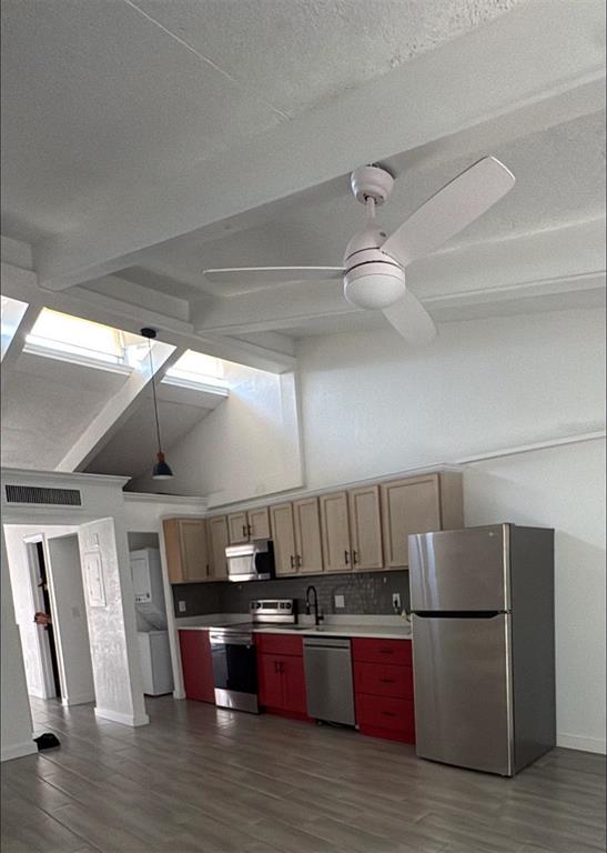 A kitchen with red lower cabinets, light wood upper cabinets, stainless steel appliances, and vaulted ceilings — 500 N JEFFERSON AVENUE UNIT G3, SARASOTA, FL