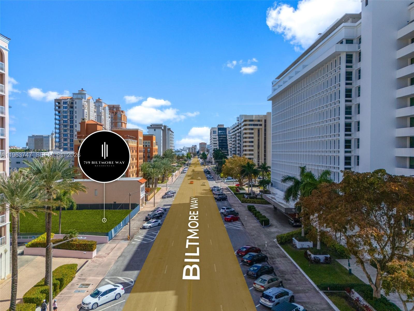 An aerial view shows a city street lined with tall buildings and palm trees — 719 Biltmore Way, Coral Gables FL 33134, CORAL GABLES, FL