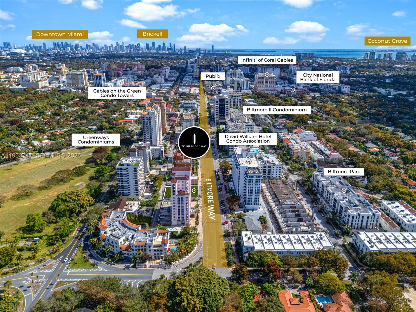 An aerial view shows a city street lined with residential buildings and commercial properties — 719 Biltmore Way, Coral Gables FL 33134, CORAL GABLES, FL