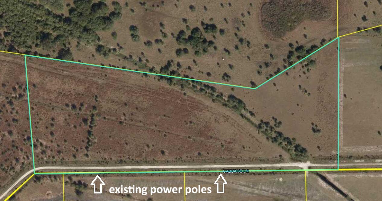 This aerial map shows a vacant plot of land bordered by a road and trees — Lot 51 Cabbage Lane, Okeechobee FL 34974, OKEECHOBEE, FL
