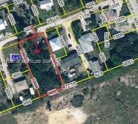 This is an aerial map view showing a rectangular property lot outlined in red — 0 SE PAGE STREET, Hobe Sound FL 33455, HOBE SOUND, FL