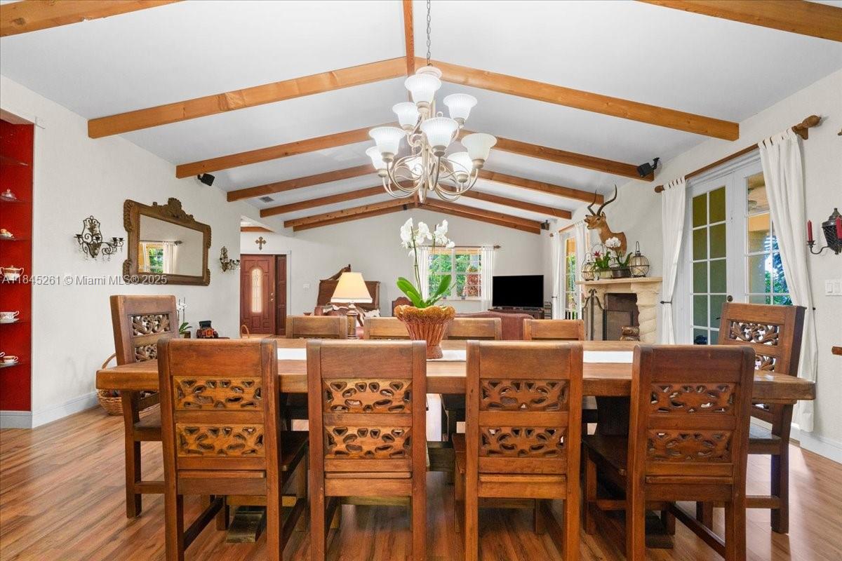 A covered outdoor patio features tiled flooring, ceiling fans, and French doors leading inside — 23600 SW 187th Ave, Homestead FL 33031, HOMESTEAD, FL