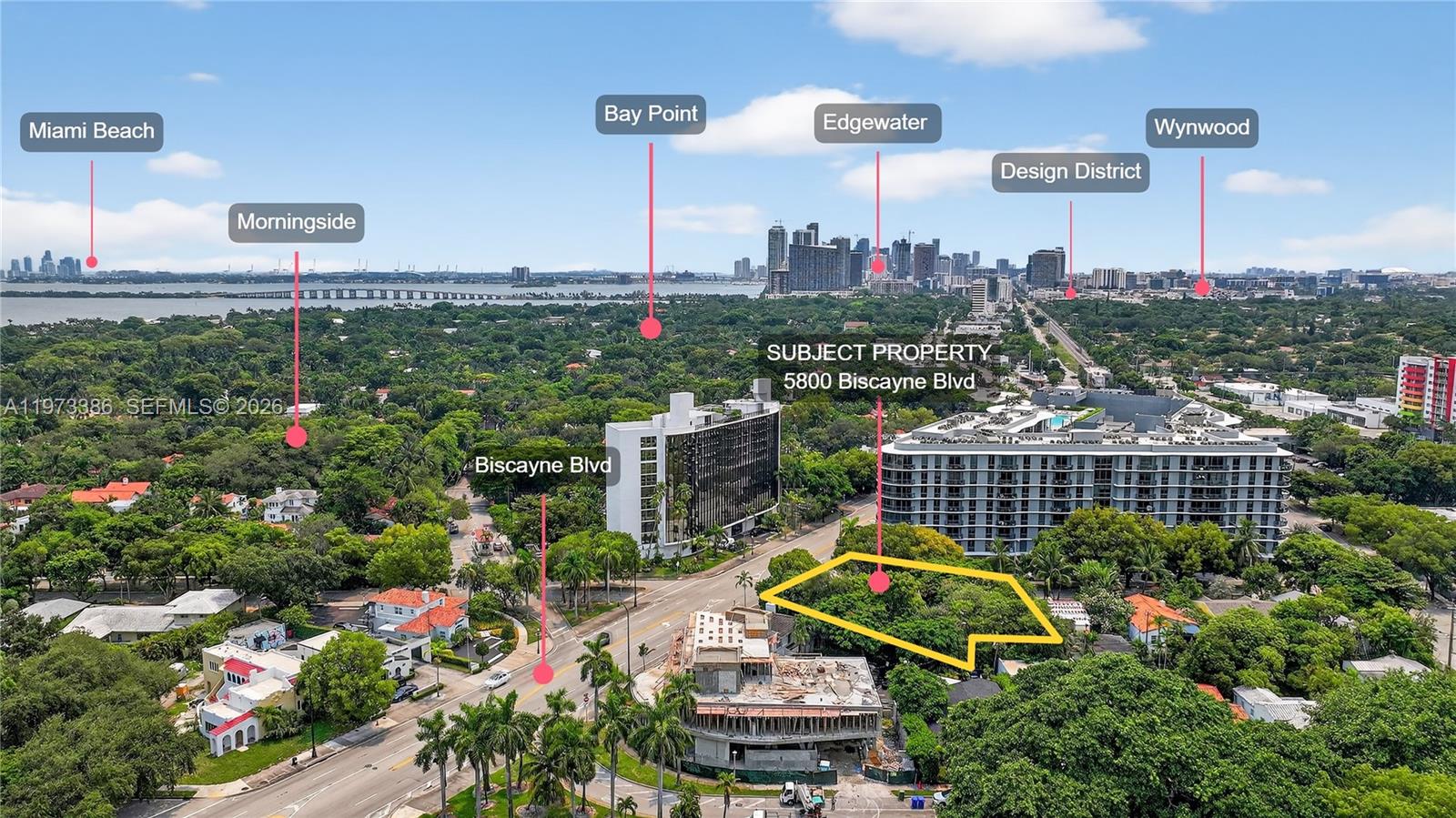 This aerial view shows a vacant, tree-covered lot situated along a busy urban boulevard — 5800 Biscayne Blvd, Miami FL 33137, MIAMI, FL