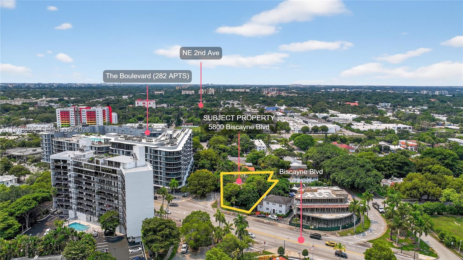 An aerial view shows a wooded lot highlighted in yellow next to a multi-story building — 5800 Biscayne Blvd, Miami FL 33137, MIAMI, FL