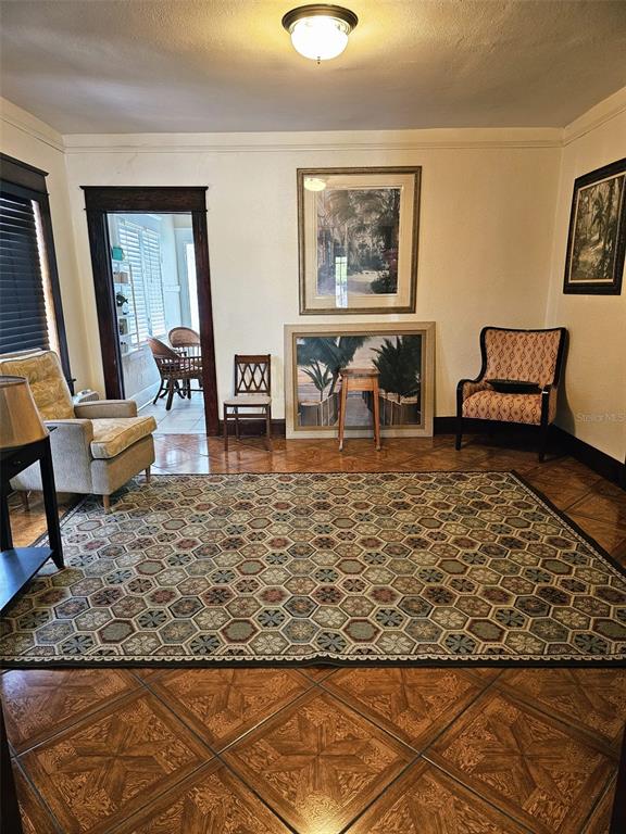 A home office features a dark wood desk, leather chairs, and framed artwork on green walls — 5409 N FLORIDA AVENUE, TAMPA, FL
