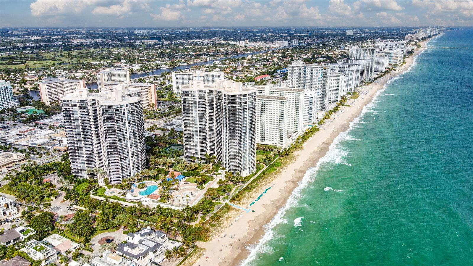 Aerial view of high-rise residential buildings along a sandy beach and the ocean — 3200 N Ocean Boulevard # 1506, Fort Lauderdale FL 33308, FORT LAUDERDALE, FL