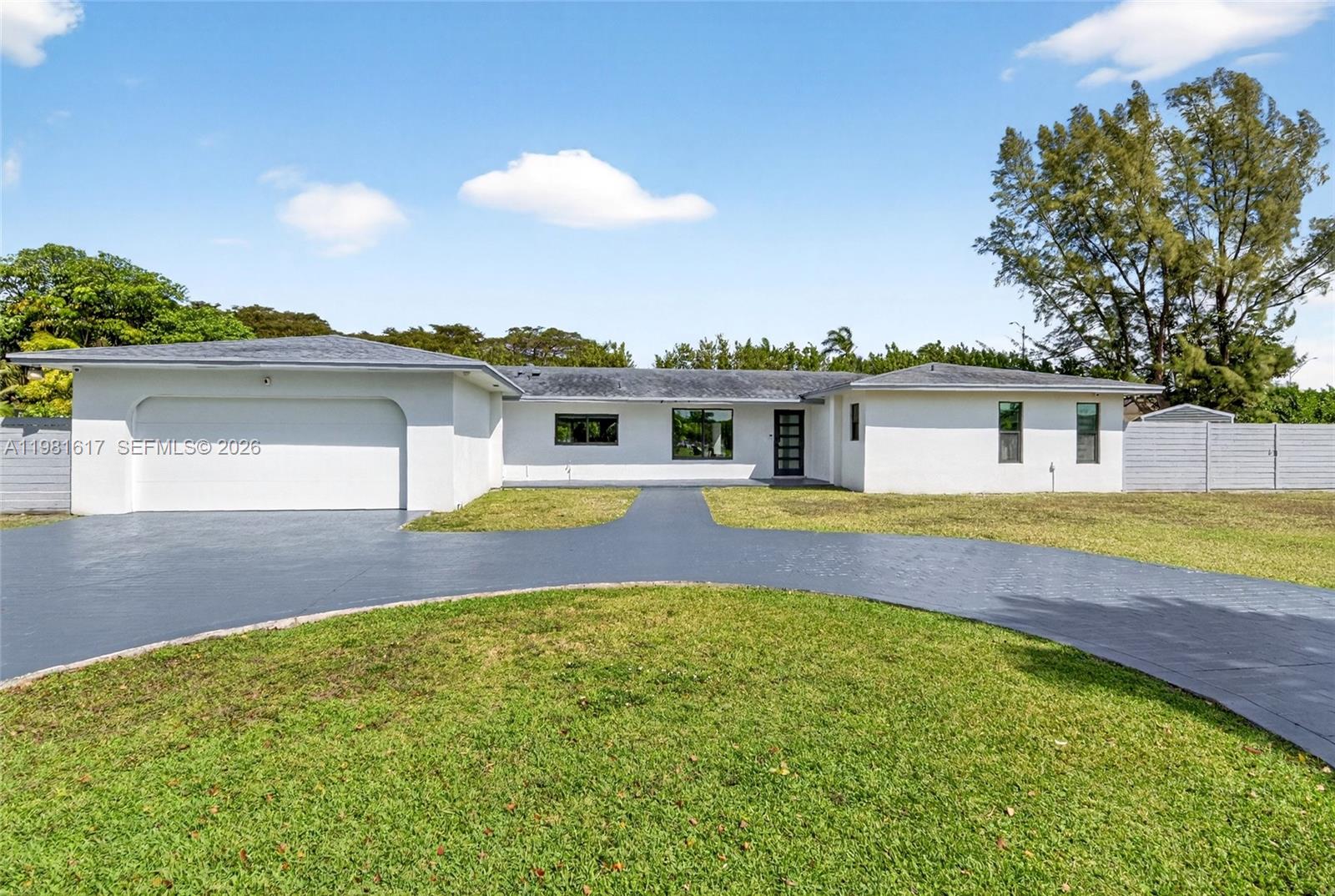 A single-story white house with a gray roof and a circular driveway — 11951 SW 120th Ter, Miami FL 33186, MIAMI, FL