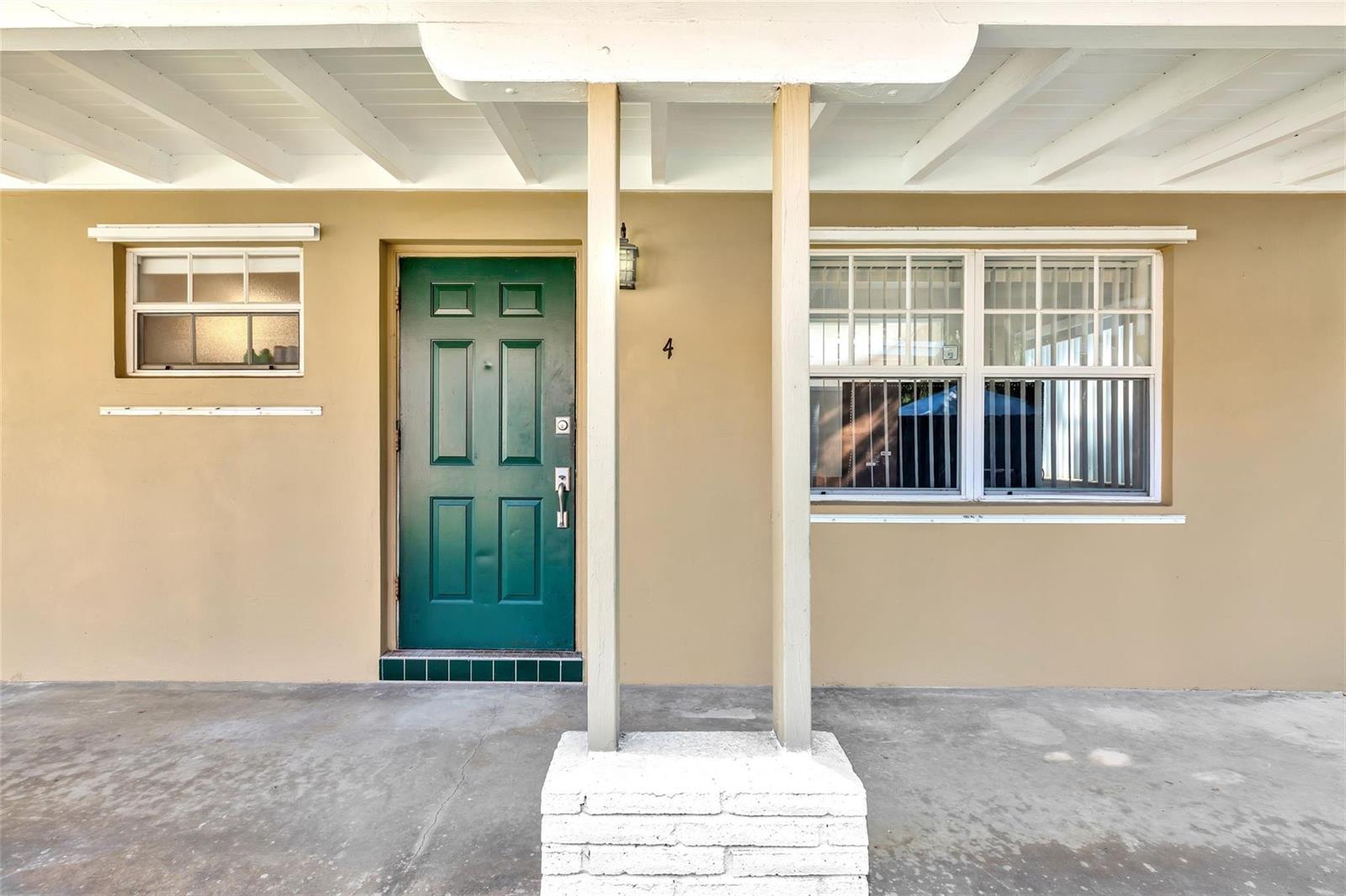 A green front door with the number four sits under a covered porch — 805 NE 17th Avenue # 4, Fort Lauderdale FL 33304, FORT LAUDERDALE, FL