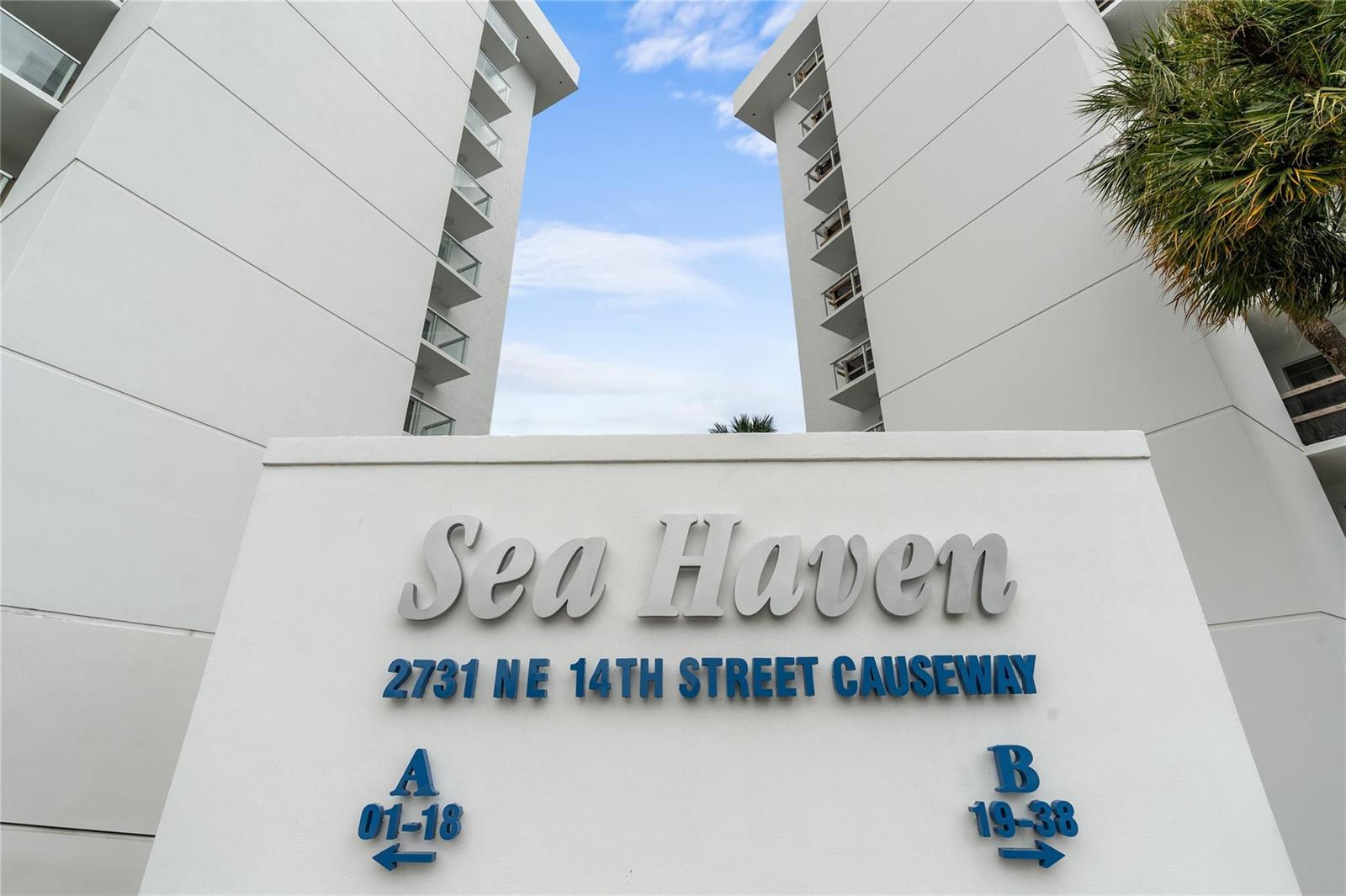 A white sign for Sea Haven stands before two tall apartment buildings under a blue sky — 2731 NE 14th Street Causeway # 637, Pompano Beach FL 33062, POMPANO BEACH, FL