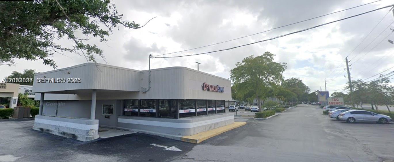 A low-rise commercial building with a drive-thru lane and an OptimumBank sign — 2215 W Hillsboro Blvd # 01, Deerfield Beach FL 33442, DEERFIELD BEACH, FL