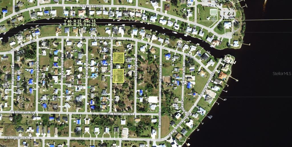 This is an aerial map showing two highlighted vacant lots located on Daffodil Terrace — 3030, 3034 , 3038 , 3050 DAFFODIL TERRACE, PUNTA GORDA, FL
