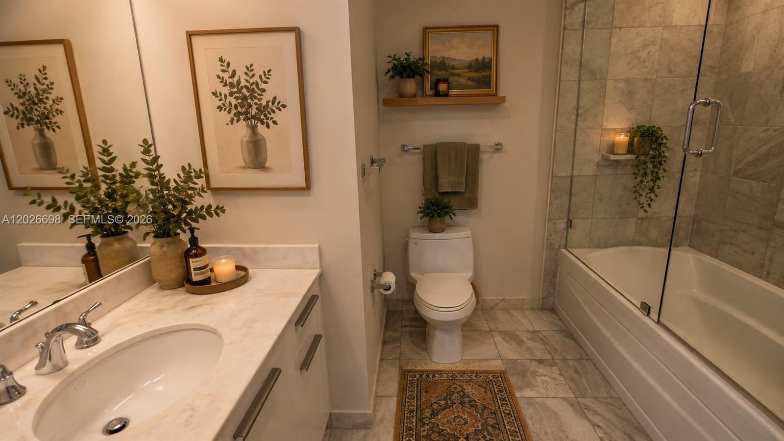 A bathroom features a white vanity, a toilet, and a glass-enclosed shower with tile walls — 1060 Brickell Ave # 1503, Miami FL 33131, MIAMI, FL