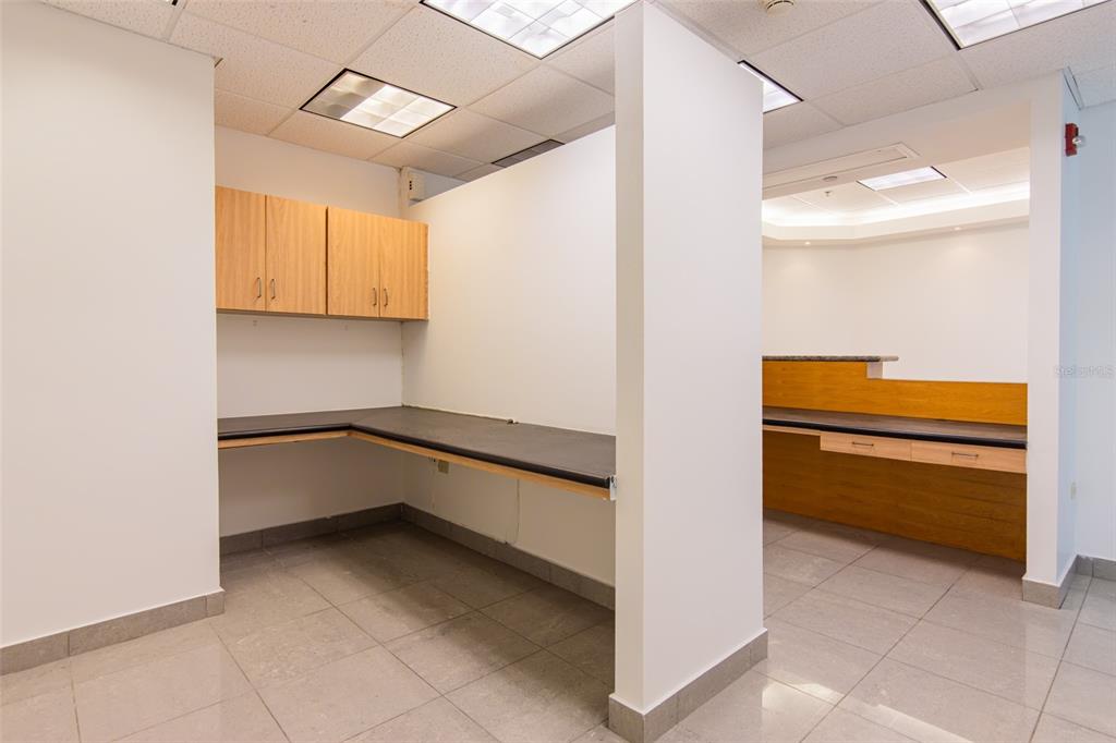 An office space features light wood cabinets, a black countertop, and light-colored tile flooring — 995 METRO MEDICAL CENTER CLL REV DOM MARRERO, BAYAMON, PR