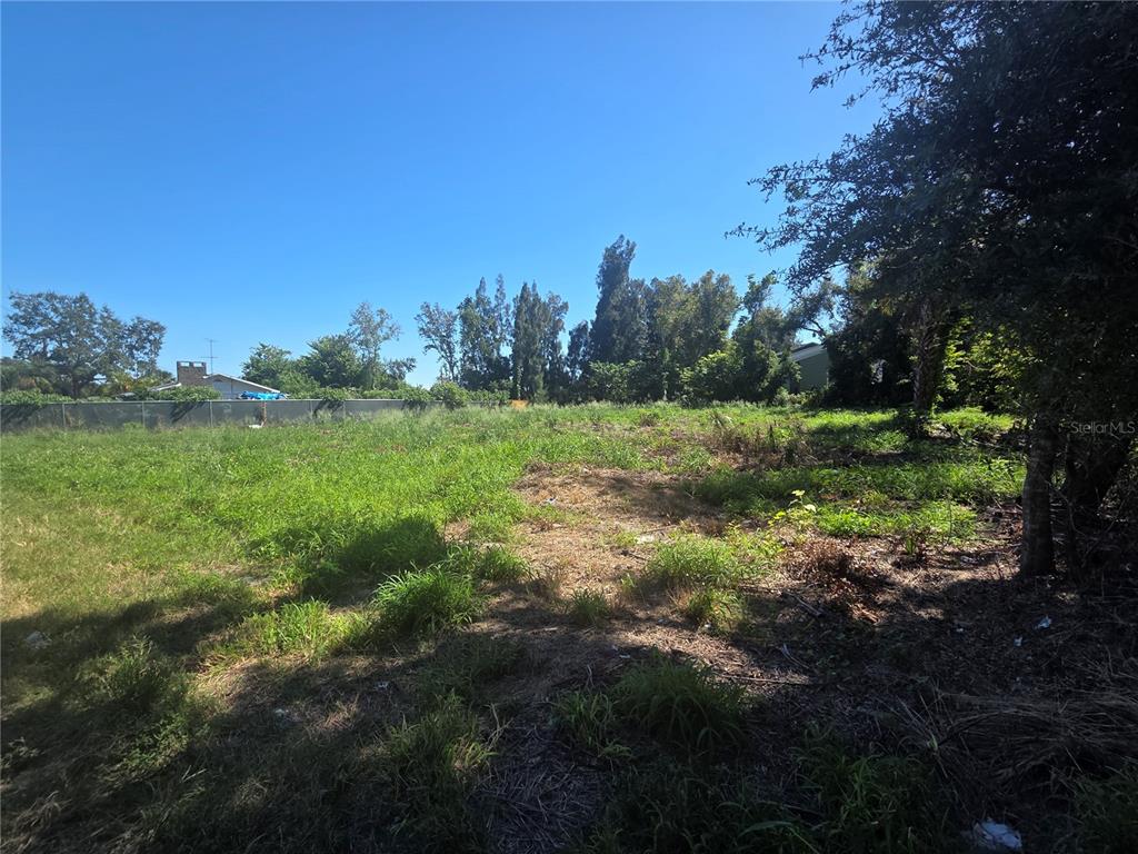 A vacant, grassy lot with scattered trees under a clear blue sky — 0 CYPRESS GARDENS ROAD, WINTER HAVEN, FL