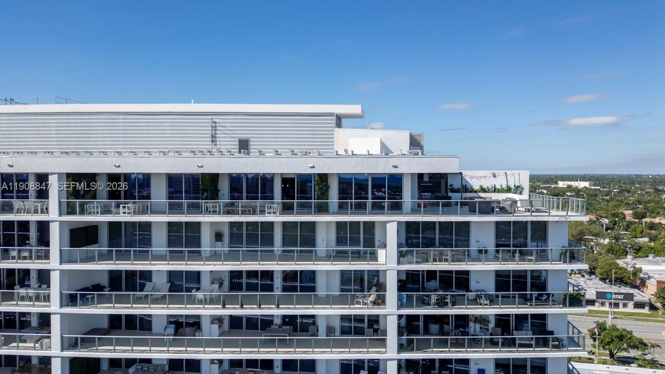 An exterior view of a multi-story apartment building with balconies and glass railings — 1180 N Federal Hwy # 1602, Fort Lauderdale FL 33304, FORT LAUDERDALE, FL