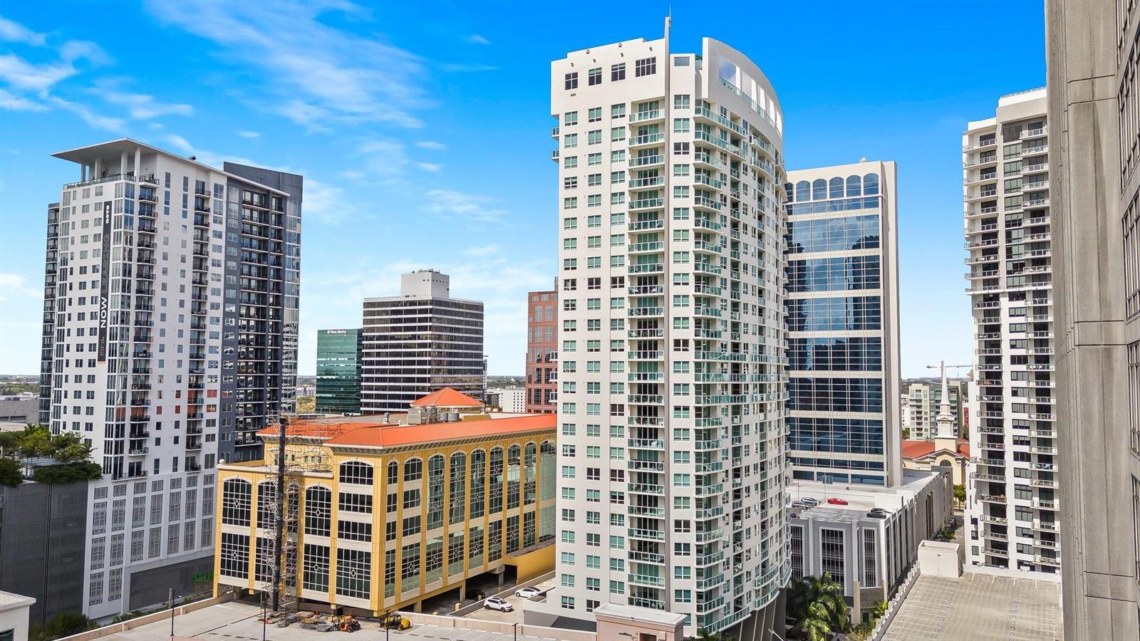 An elevated view of several modern high-rise apartment buildings and a yellow parking structure — 350 SE 2nd Street # 2960, Fort Lauderdale FL 33301, FORT LAUDERDALE, FL