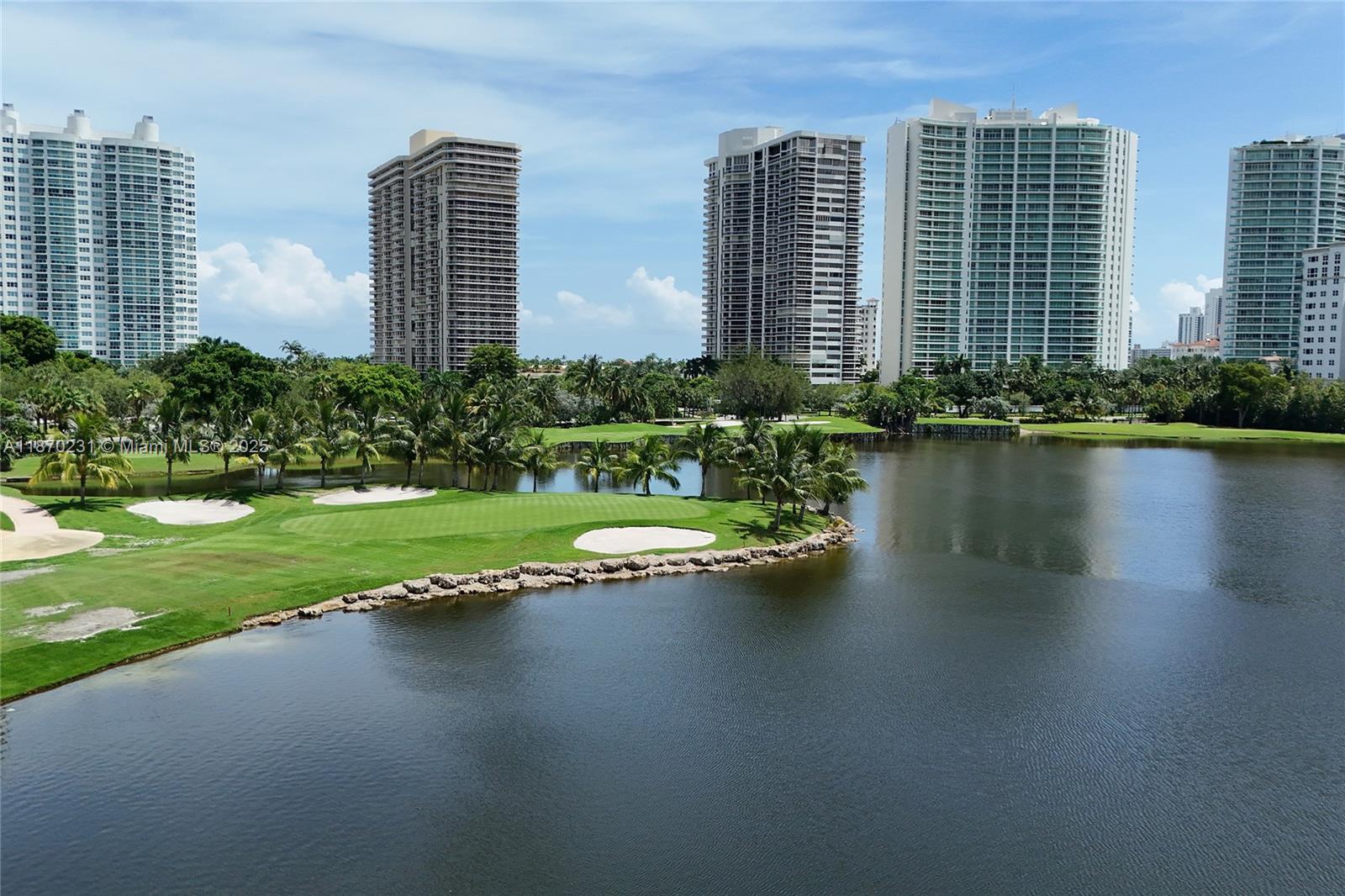 An elevated view shows a golf course green and sand bunkers beside a large lake — 3675 N Country Club Dr # 204, Aventura FL 33180, AVENTURA, FL