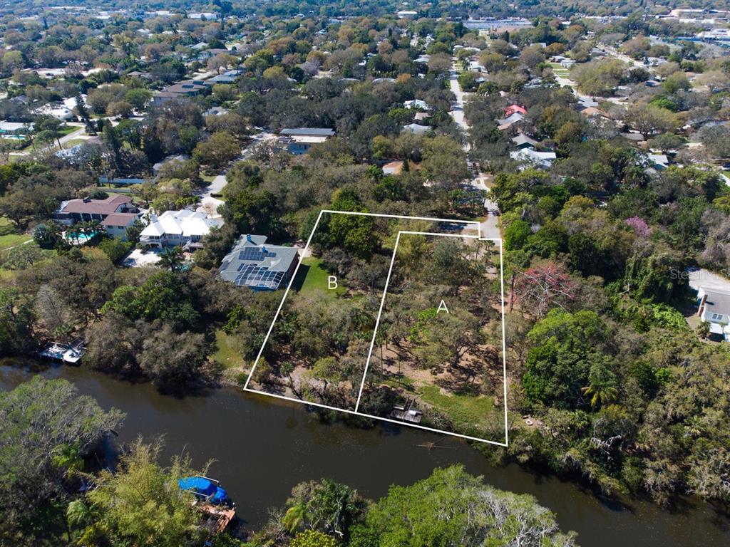 An aerial view shows two adjacent, wooded waterfront lots marked A and B — 4407 S SHADE AVENUE, SARASOTA, FL
