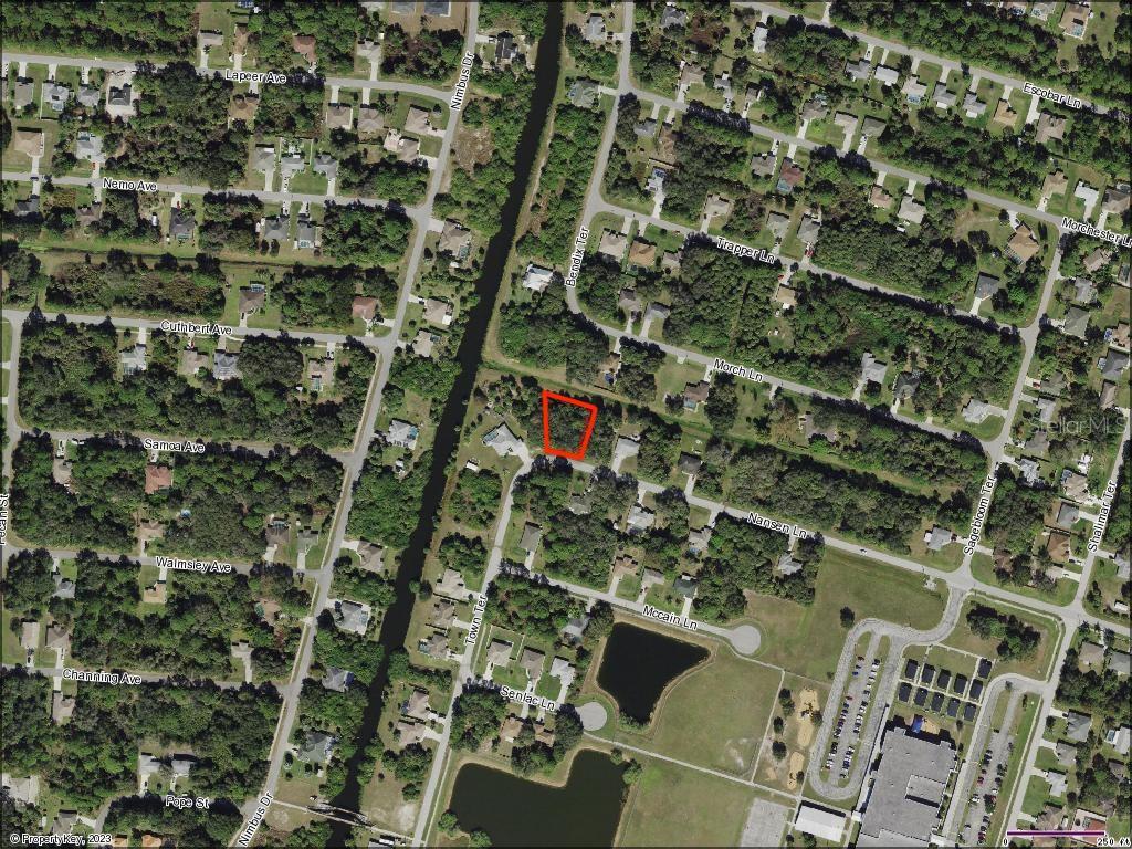This is an aerial map showing a residential neighborhood with a highlighted vacant lot — Lot 5 NANSEN LANE, NORTH PORT, FL