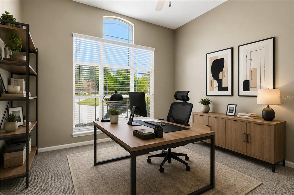 A home office features a wooden desk, a black chair, a bookshelf, and a window — 1413 COURSE VIEW, ORANGE PARK, FL