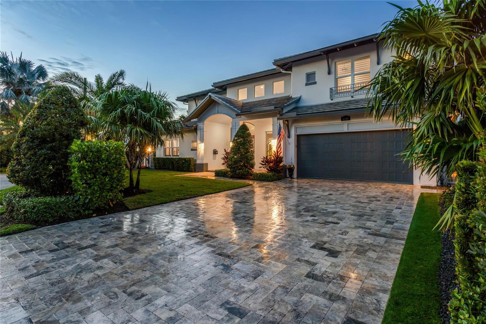 A two-story house exterior with a paved driveway, a garage, and surrounding palm trees — 1580 SE 8th Street, Deerfield Beach FL 33441, DEERFIELD BEACH, FL