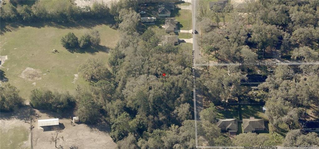 This is an aerial map view of a wooded residential lot — 00 NW 52ND AVENUE Lot 6, OCALA, FL