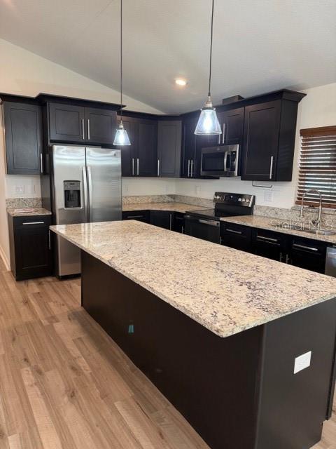 A kitchen features dark cabinets, granite countertops, stainless steel appliances, and a large center island — 902 W ALSOBROOK STREET, PLANT CITY, FL