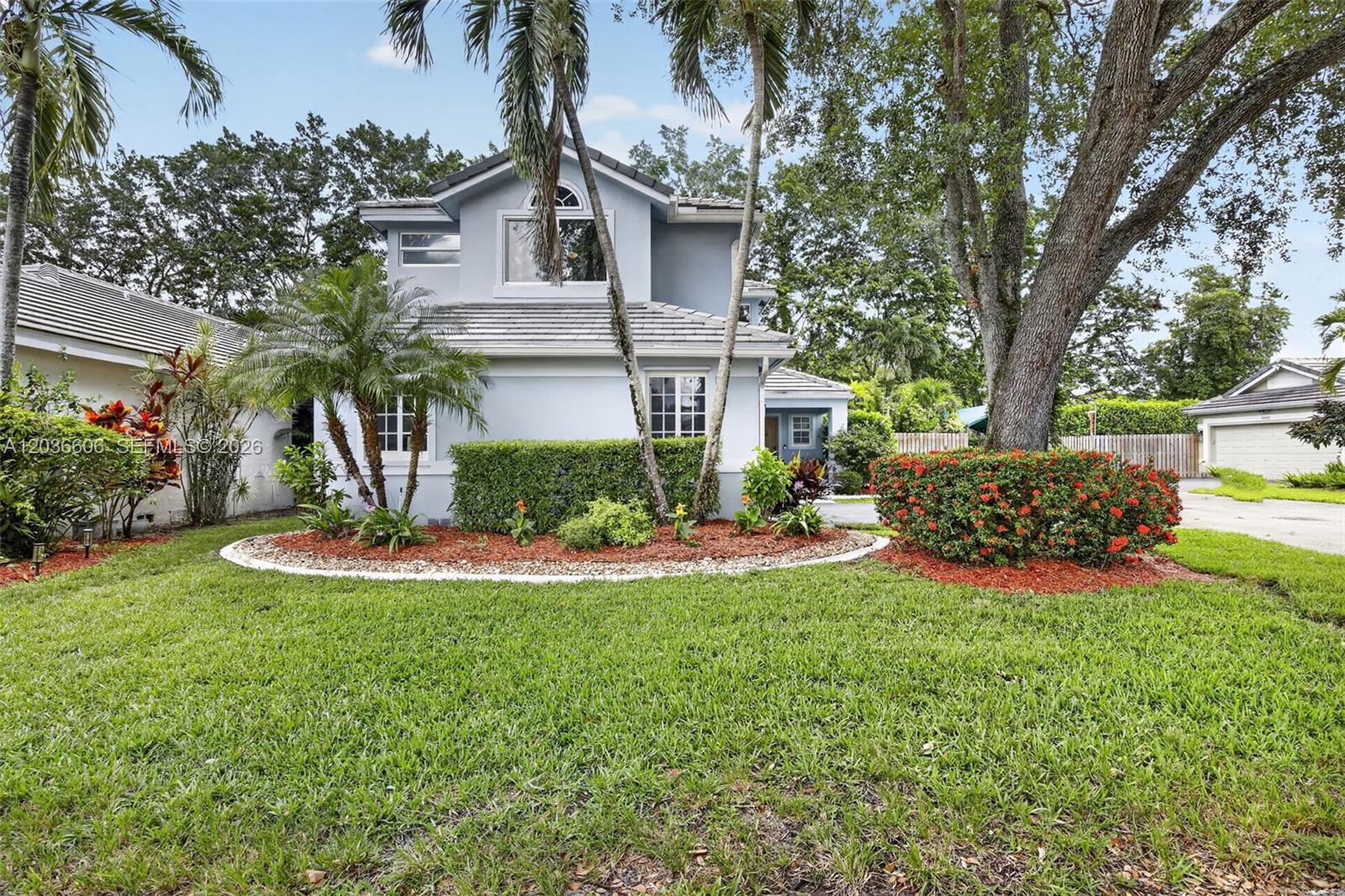A brick entrance sign for Forest Ridge community is surrounded by landscaping and palm trees — 8815 Woodside Ct, Davie FL 33328, DAVIE, FL
