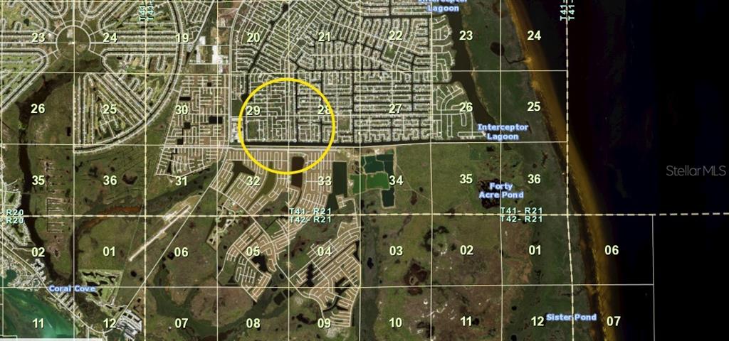 This is a satellite map view showing residential neighborhoods and surrounding land sections — 10425 WINNIPEG STREET, PORT CHARLOTTE, FL