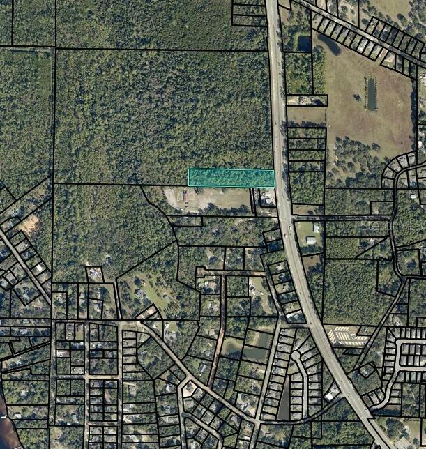 This is an aerial map showing a highlighted rectangular parcel of land — TBD HWY 87 S, NAVARRE, FL