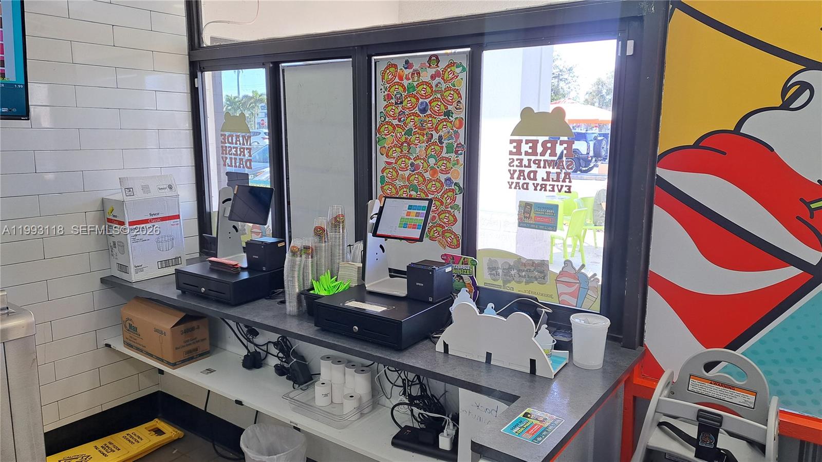 A service counter features two point-of-sale systems, stacks of cups, and a window view — 3650 N Federal Highway, Lighthouse Point FL 33060, LIGHTHOUSE POINT, FL