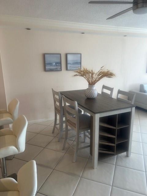 A dining area features a high-top table with built-in shelving and four matching chairs — 1160 N Federal Highway # 1118, Fort Lauderdale FL 33304, FORT LAUDERDALE, FL