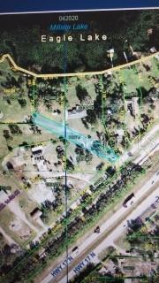 This is an aerial map showing a highlighted property parcel near a lake and highway — 0 LAKE MILLSITE RD E, WINTER HAVEN, FL