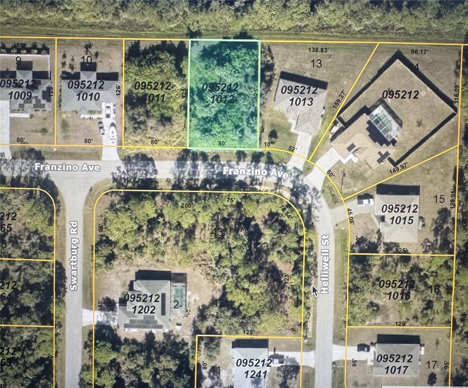 This is an aerial map showing a vacant residential lot highlighted in light blue — FRANZINO AVENUE, NORTH PORT, FL