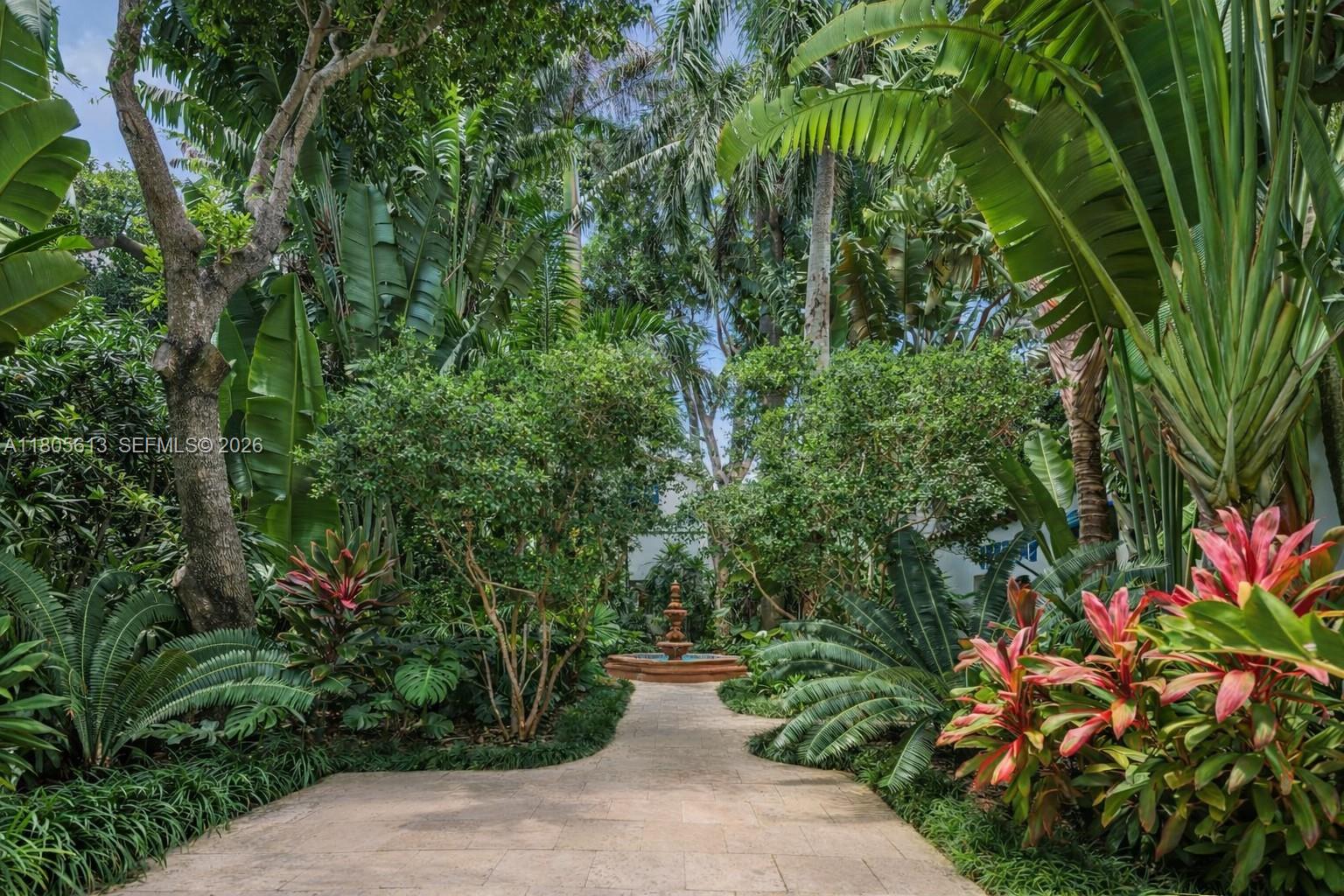 A wooden dock features outdoor furniture overlooking a bay with a distant city skyline — 56 S Hibiscus Dr, Miami Beach FL 33139, MIAMI BEACH, FL