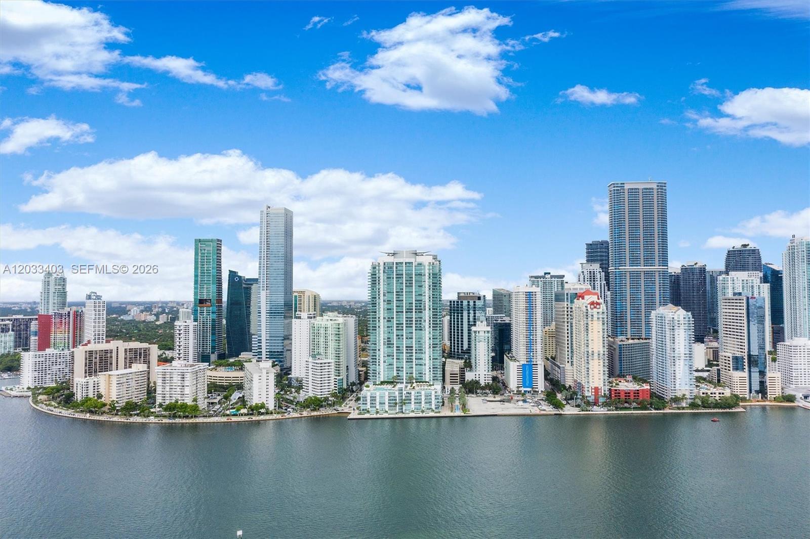An aerial view of the Miami skyline featuring numerous high-rise buildings along the waterfront — 1331 Brickell Bay Dr # 1409, Miami FL 33131, MIAMI, FL