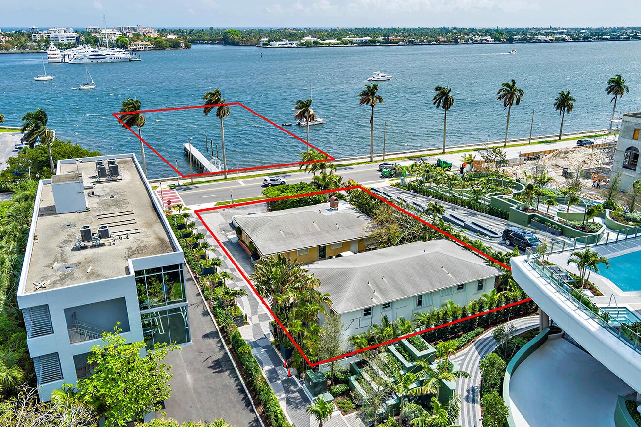 An aerial view shows two adjacent properties, one with a private dock on the water — 1301 S Flagler Drive, West Palm Beach FL 33401, WEST PALM BEACH, FL