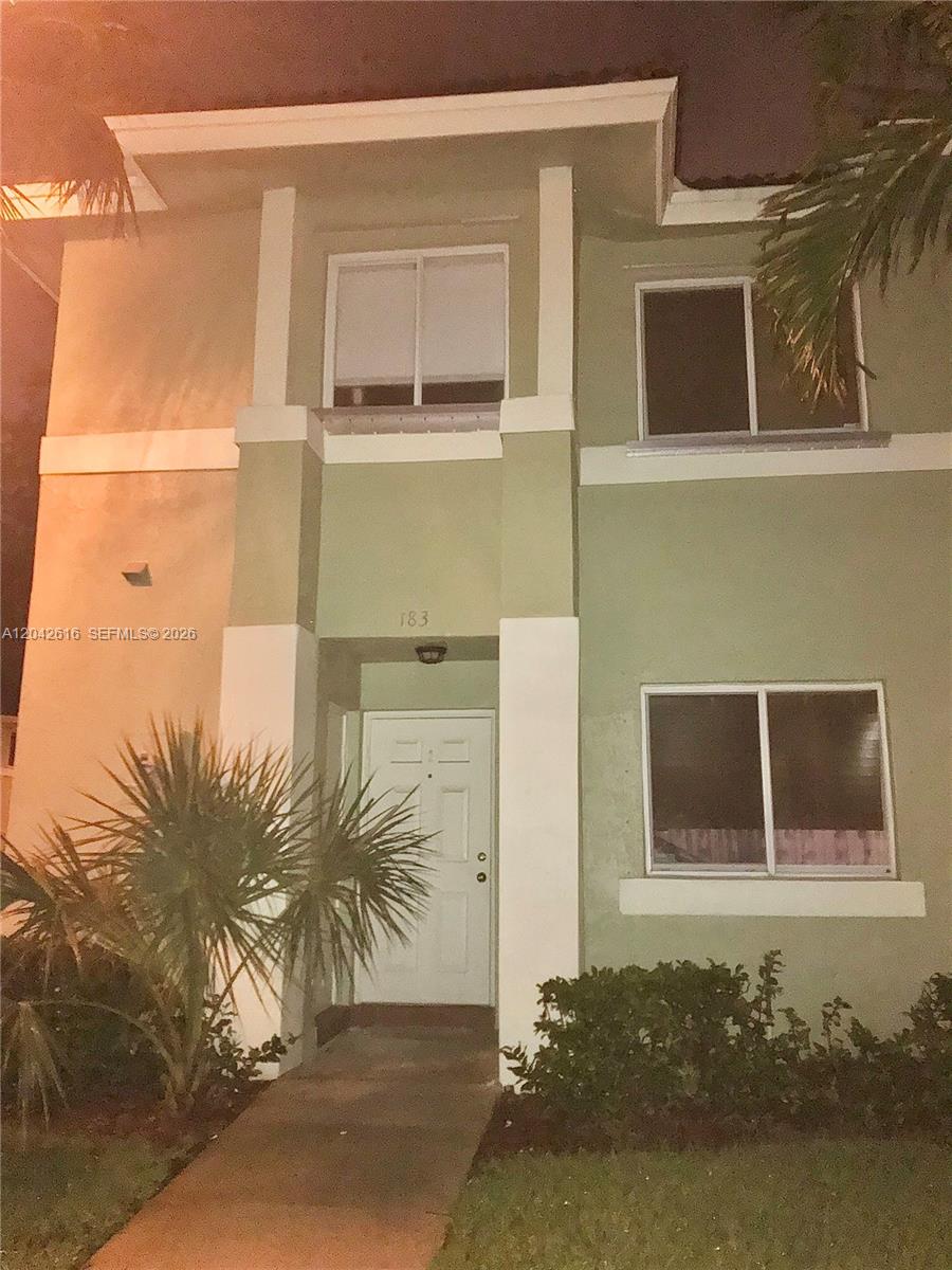 A two-story, light green residential building with a white front door and walkway — 183 Hidden Ct Rd # 33, Hollywood FL 33023, HOLLYWOOD, FL