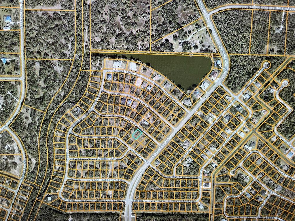 This is an aerial map showing a residential neighborhood with a highlighted vacant lot — LOT 12 IBSON LANE, NORTH PORT, FL