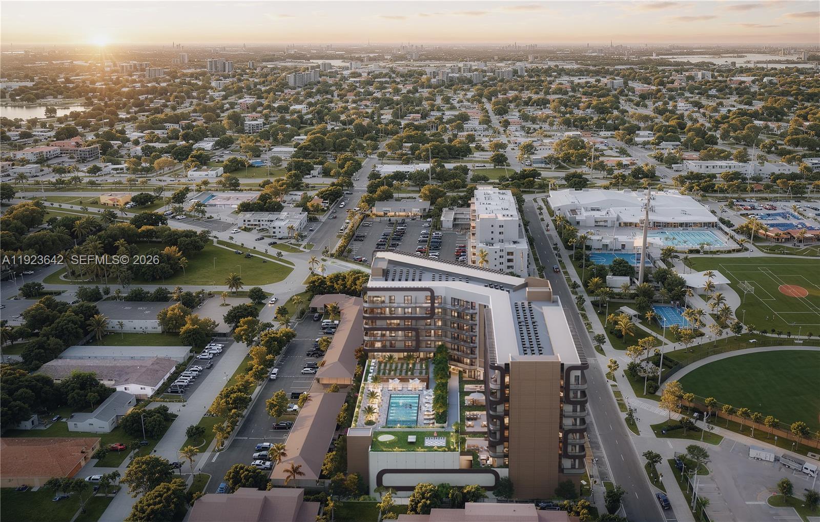 This is a rendering of a modern apartment building with a pool and parking lot — 218 SE 7th St # 612B, Hallandale Beach FL 33009, HALLANDALE BEACH, FL