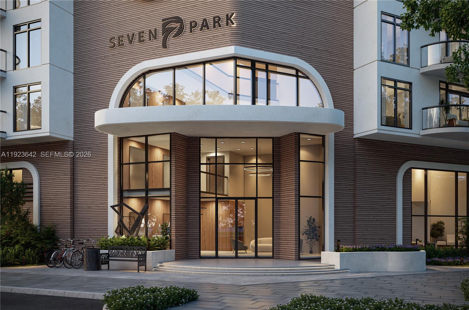 This is a rendering of the modern exterior entrance to a building named Seven Park — 218 SE 7th St # 612B, Hallandale Beach FL 33009, HALLANDALE BEACH, FL