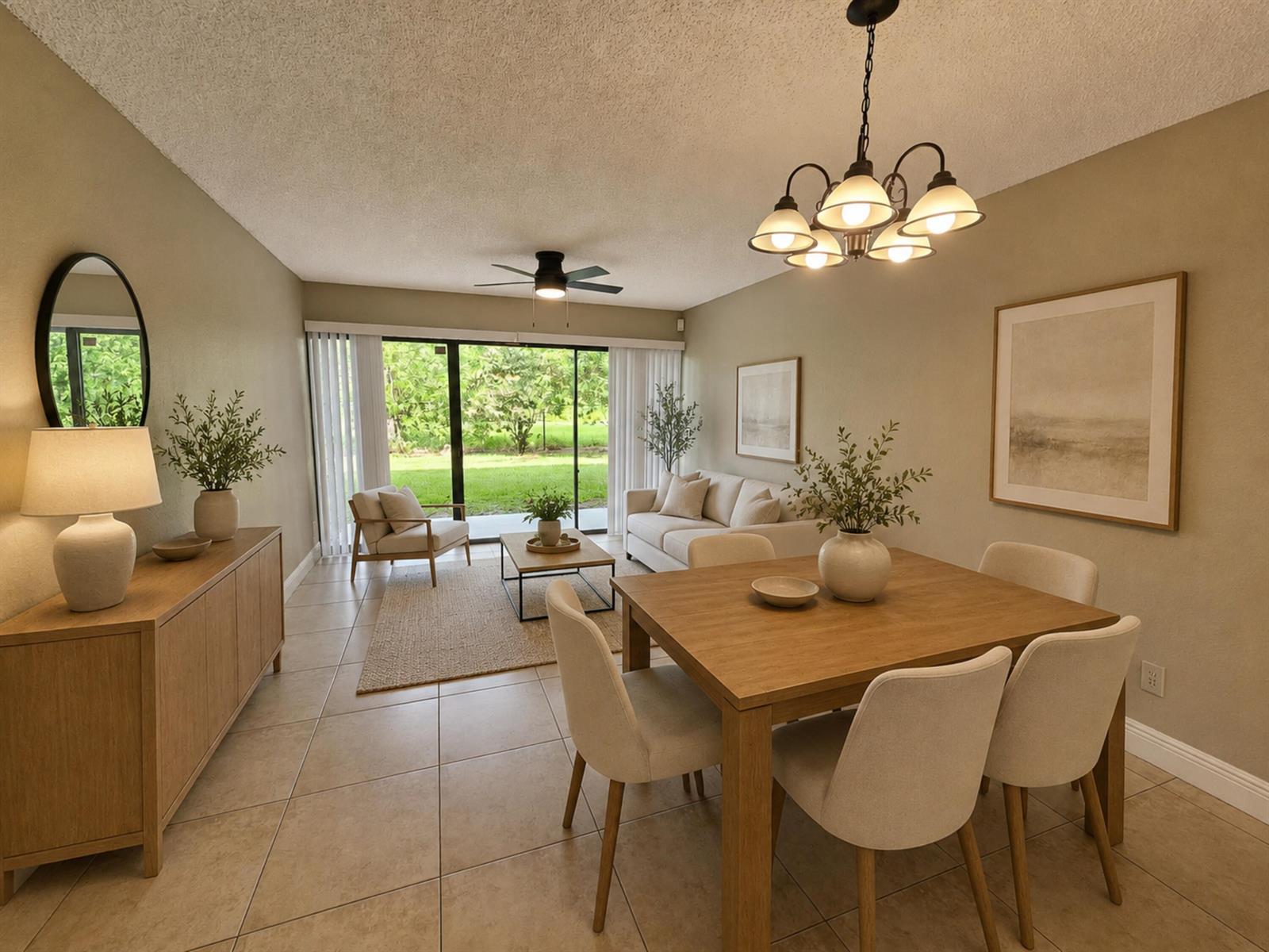 A dining area and living room with tile floors, neutral furniture, and sliding glass doors — 1461 Windorah Way # C, West Palm Beach FL 33411, WEST PALM BEACH, FL