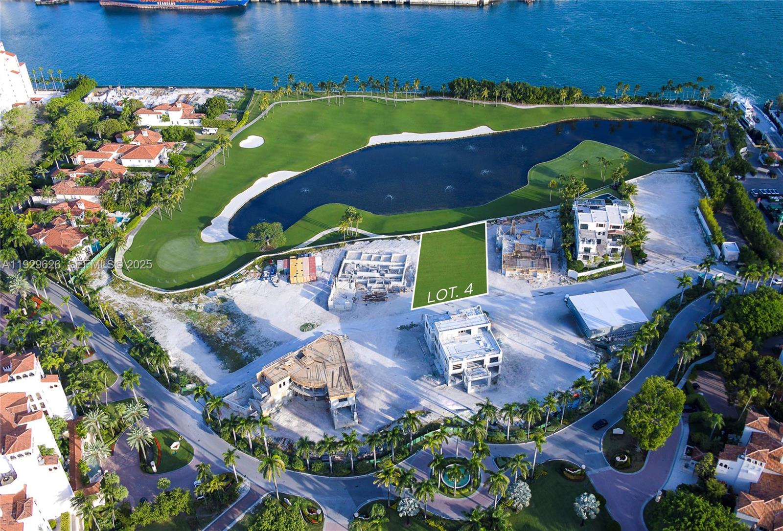 An aerial view shows a vacant residential lot marked as Lot 4 near a golf course — 1004 Fisher Island Drive, Miami Beach FL 33109, MIAMI BEACH, FL