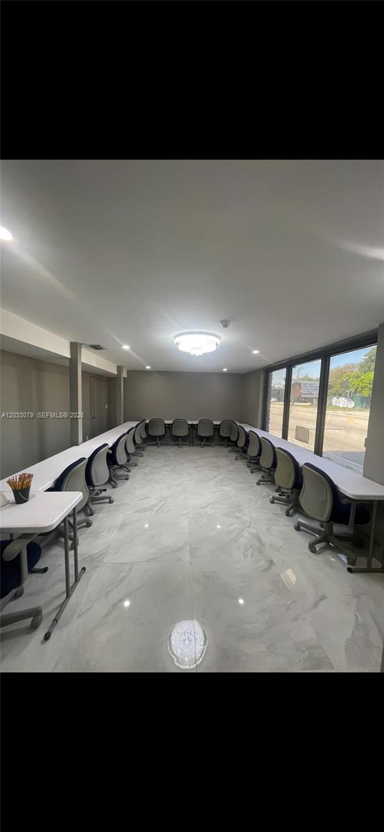 A conference room features a U-shaped table arrangement, rolling chairs, and light-colored marble flooring — 5851 NW 17th Ave, Miami FL 33142, MIAMI, FL