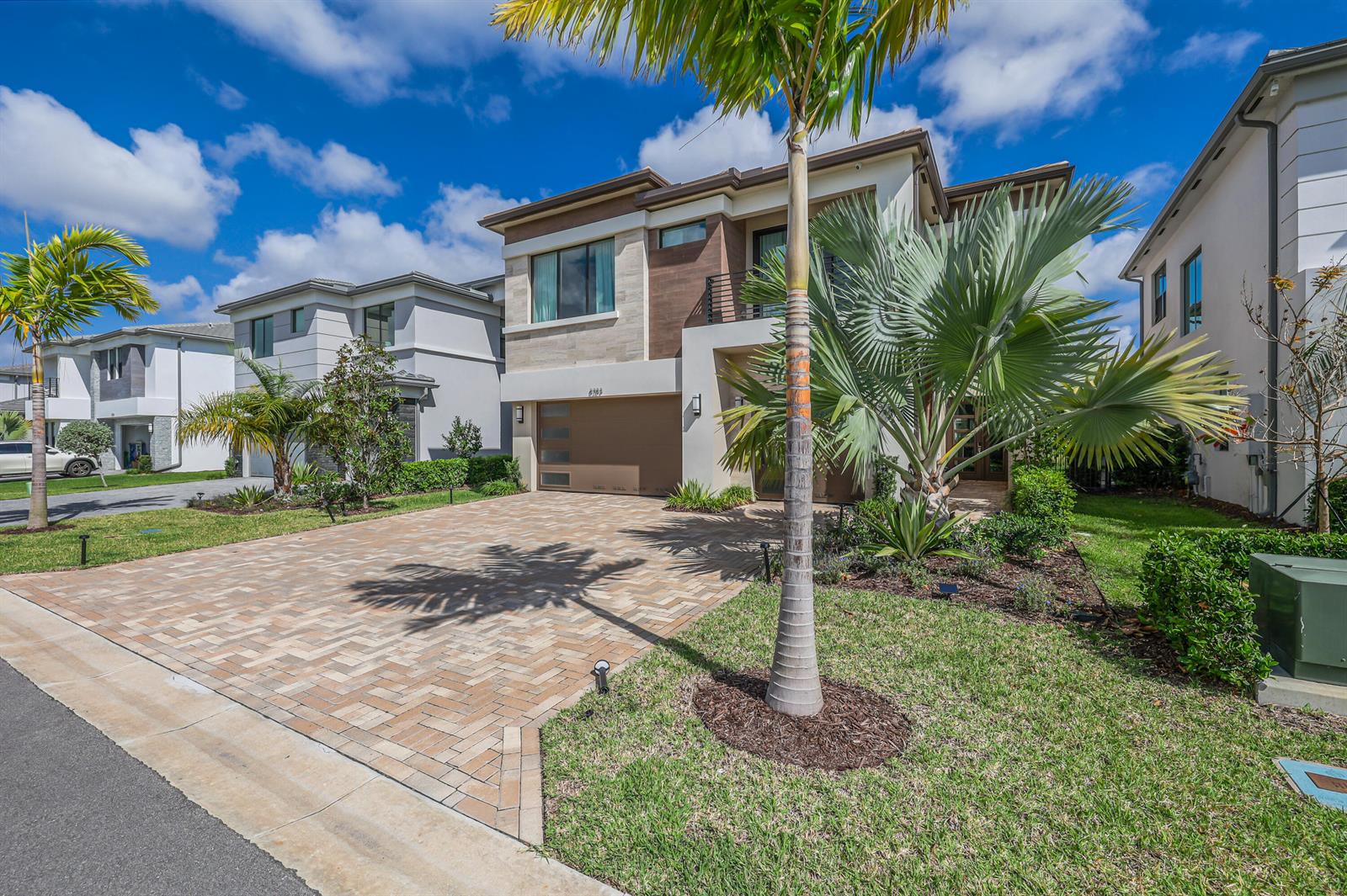 A two-story house with a paved driveway, palm trees, and a two-car garage — 8283 Royal County Down Road, Boca Raton FL 33434, BOCA RATON, FL