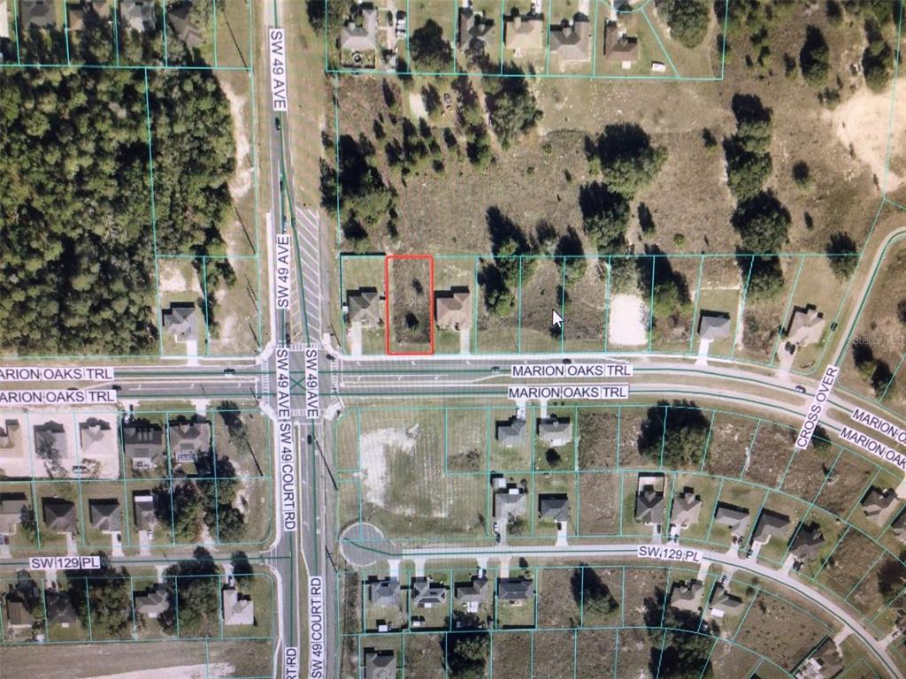 An aerial map view highlights a vacant rectangular lot situated between two existing houses — 0 MARION OAKS TRAIL, OCALA, FL