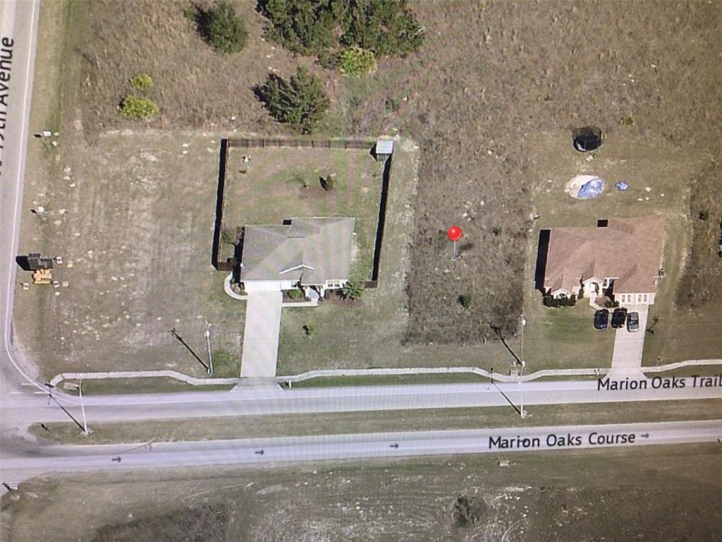 This aerial map shows two houses and a vacant lot along Marion Oaks Trail — 0 MARION OAKS TRAIL, OCALA, FL