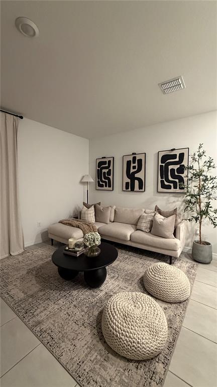 A living room features a beige sectional sofa, a round black coffee table, and wall art — 2966 CANARY AVENUE, DAVENPORT, FL